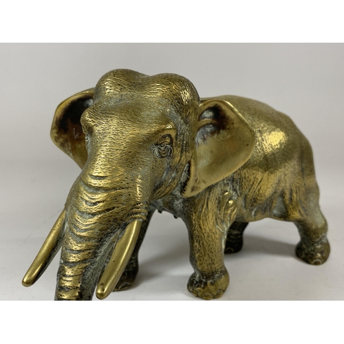 395 - A CHINESE SOLID BRASS ELEPHANT FIGURE WITH CHINESE CHARACTER MARK TO FOOT, LENGTH 22CM