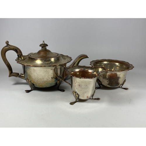 96 - A VINTAGE SILVER PLATE ON COPPER THREE PIECE TEA SET