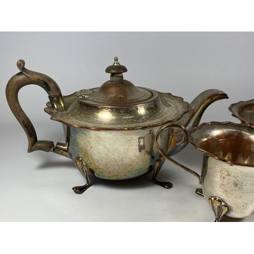 96 - A VINTAGE SILVER PLATE ON COPPER THREE PIECE TEA SET