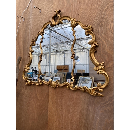 1222 - A LARGE DECORATIVE GILT FRAMED WALL MIRROR