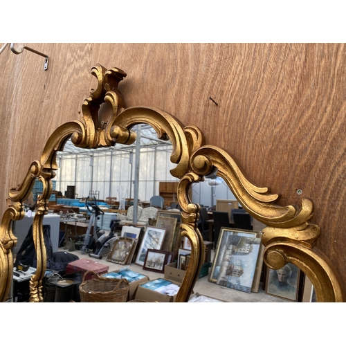 1222 - A LARGE DECORATIVE GILT FRAMED WALL MIRROR