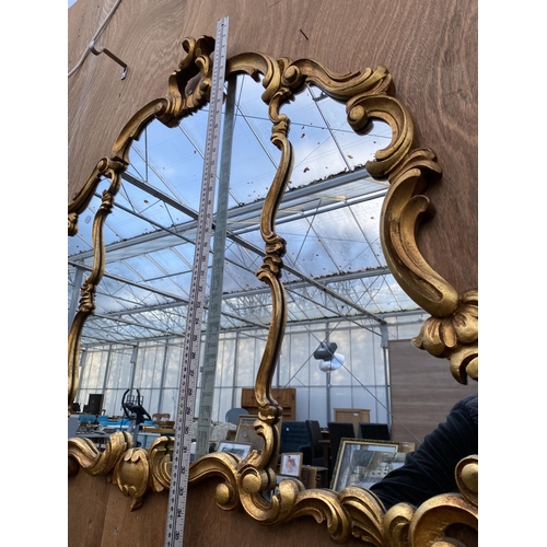 1222 - A LARGE DECORATIVE GILT FRAMED WALL MIRROR