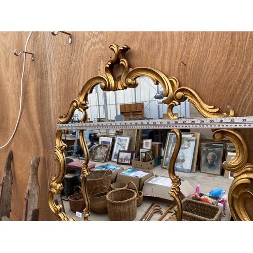 1222 - A LARGE DECORATIVE GILT FRAMED WALL MIRROR