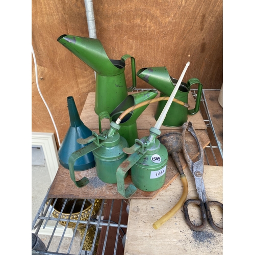 1234 - AN ASSORTMENT OF ITEMS TO INBCLUDE A GRADUATED SET OF GREEN OIL JUGS, A WESCO PUMP ACTION OIL CAN AN... 