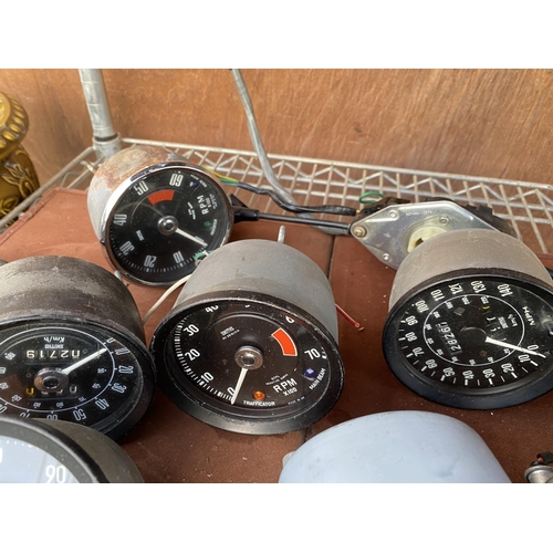 1237 - AN ASSORTMENT OF VINTAGE AUTOMOBILE DASHBOARD GAUGES TO INCLUDE SPEEDOMETERS, CLOCKS AND OIL GAUGES ... 