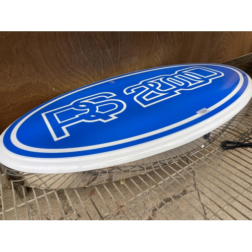 1239 - A LARGE OVAL RS2000 ILLUMINATED LIGHT BOX SIGN - WORKING ORDER AT TIME OF CATALOGUING.  WIDTH 86CM, ... 