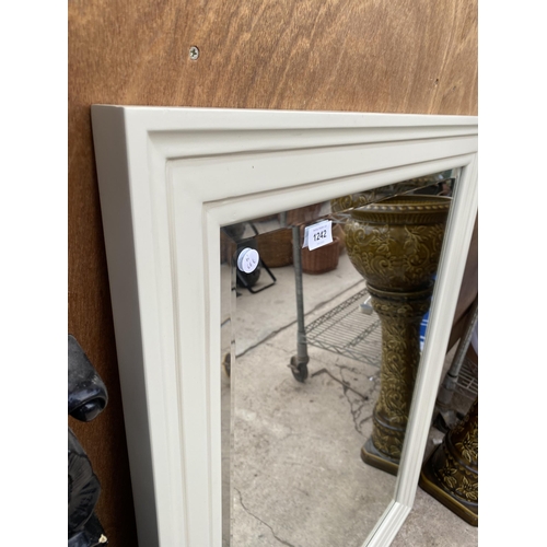 1242 - A CREAM FRAMED BEVELED EDGE WALL MIRROR