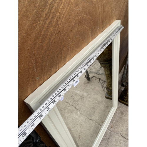 1242 - A CREAM FRAMED BEVELED EDGE WALL MIRROR