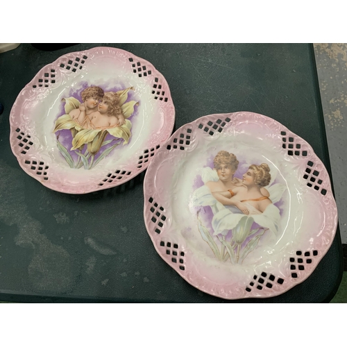 102 - TWO DECORATIVE CABINET PLATES WITH CHERUB DESIGN AND PIERCED EDGES DIAMETER 22CM