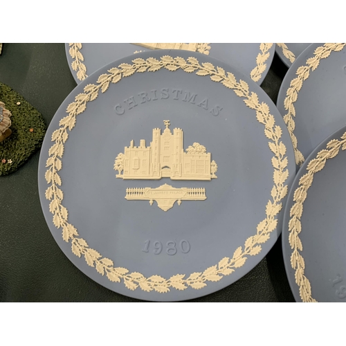 107 - A COLLECTION OF WEDGWOOD JASPERWARE CHRISTMAS PLATES PLUS ONE TO COMMEMORATE THE FIRST MAN ON THE MO... 