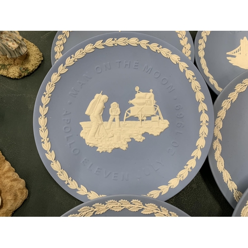 107 - A COLLECTION OF WEDGWOOD JASPERWARE CHRISTMAS PLATES PLUS ONE TO COMMEMORATE THE FIRST MAN ON THE MO... 