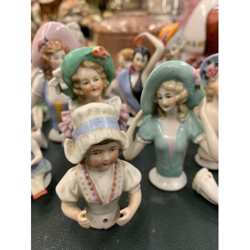 119 - A COLLECTION OF CERAMIC SEWING/PIN CUSHION LADIES