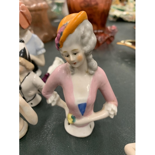 119 - A COLLECTION OF CERAMIC SEWING/PIN CUSHION LADIES