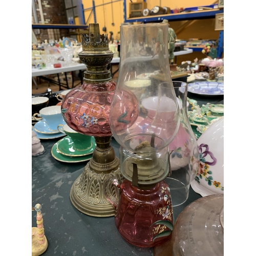 120 - TWO VINTAGE OIL LAMPS WITH HANDPAINTED GLASS PLUS SIX GLASS SHADES