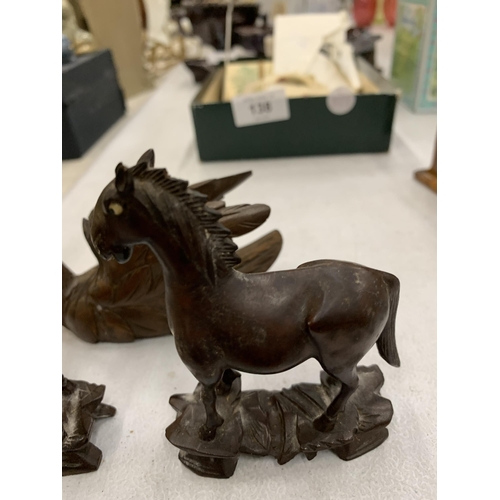 136 - THREE PIECES OF CARVED TREEN TO INCLUDE TWO HORSES AND A SWAN WITH AN ARTICULATED NECK