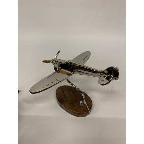 147 - A CHROME SPITFIRE ON A WOODEN BASE HEIGHT 20CM