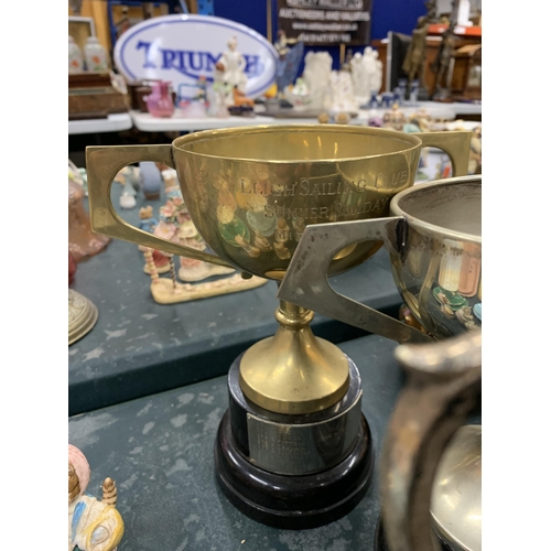 171 - FOUR SILVER PLATED TROPHY CUPS ALL FROM LEIGH SAILING CLUB PLUS A BRASS TEAPOT