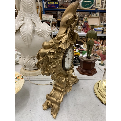 212 - A ROCCOCO STYLE GOLD COLOURED MANTLE CLOCK HEIGHT 38CM