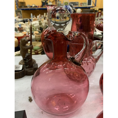 235 - A LARGE QUANTITY OF CRANBERRY GLASSWARE TO INCLUDE MAINLY JUGS, SOME WITH STOPPERS AND PONTIL MARKS