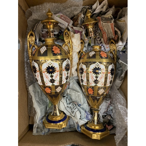 239 - A PAIR OF ROYAL CROWN DERBY LIDDED URN STYLE VASES, BOTH WITH EXTENSIVE DAMAGE