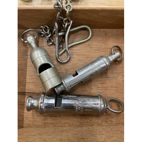 296 - SIX VINTAGE POLICE WHISTLES, TWO WITH CHAINS