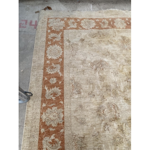 2192 - A LARGE CREAM AND ORANGE RUG