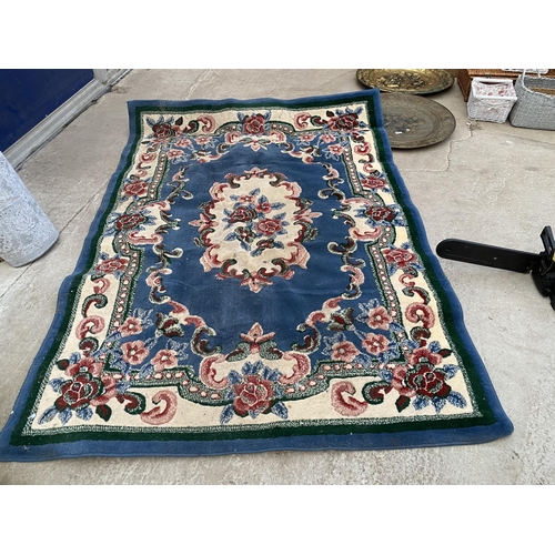 2196 - A BLUE PETTERNED RUG