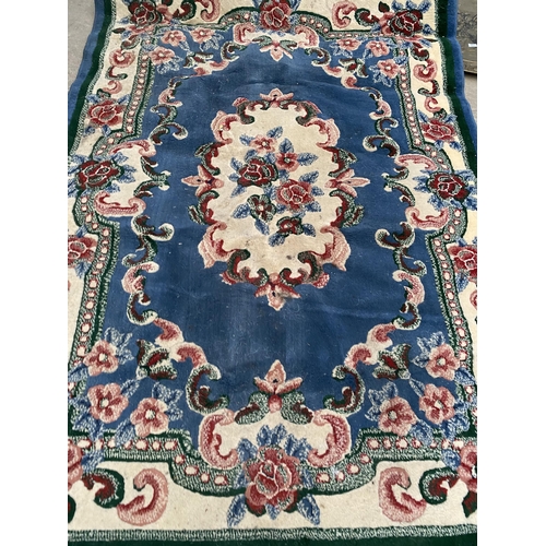 2196 - A BLUE PETTERNED RUG