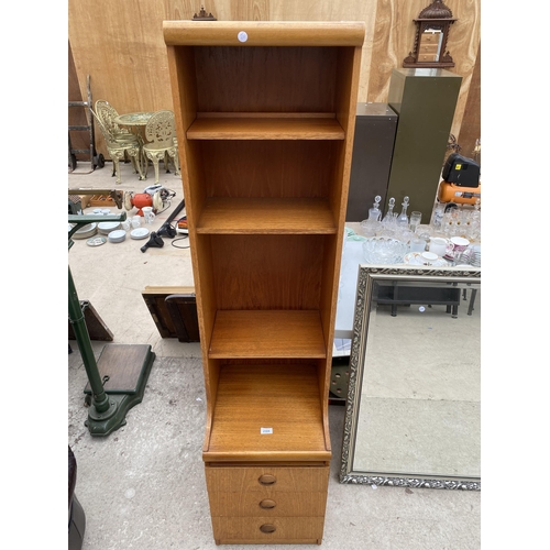 A RETRO TEAK NARROW UNIT WITH OPEN SHELVES AND THREE DRAWERS TO BASE 16