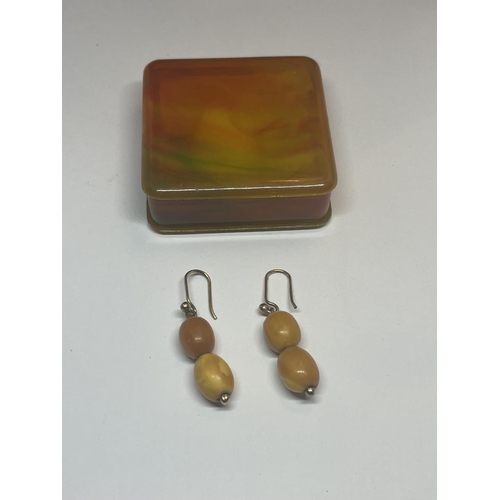 406 - A APIR OF BUTTERSCOTCH AMBER TWO STONE DROP EARRINGS IN A PRESENTATION BOX