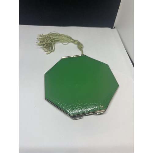 421 - A BRITISH MADE  ART DECO GREEN AND CHROME COMPACT WITH BEAUTIBOX PAD AND A  TASSEL UNUSED AS NEW