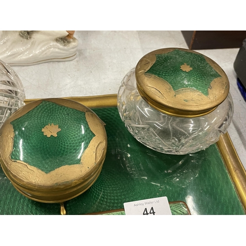 44 - A VINTAGE GREEN ENAMEL BACKED DRESSING TABLE SET COMPRISING TRAY, BRUSHES, MIRROR AND POTS