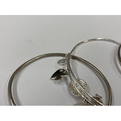 147 - THREE ASSORTED SILVER BANGLES