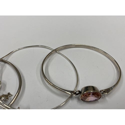 147 - THREE ASSORTED SILVER BANGLES