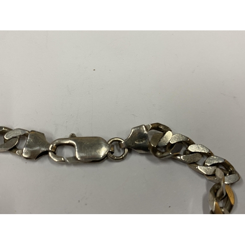 148 - A SILVER FLAT LINK CURB BRACELET