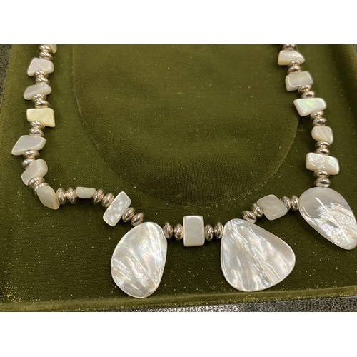 150 - A BOXED SILVER AND MOTHER OF PEARL EFFECT NECKLACE