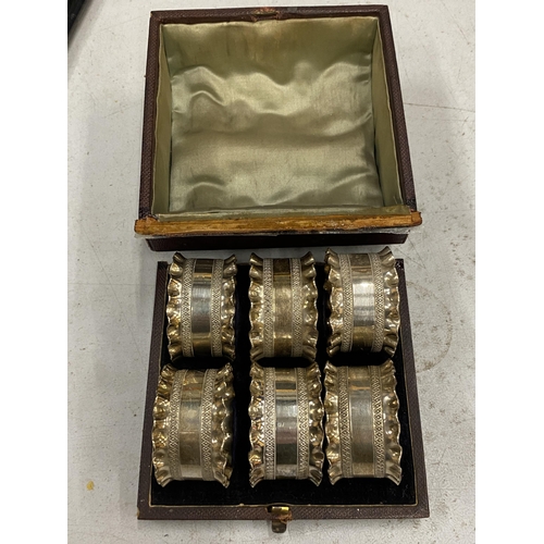 156 - A BOXED SET OF SIX SILVER PLATED NAPKIN RINGS