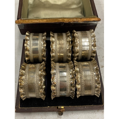 156 - A BOXED SET OF SIX SILVER PLATED NAPKIN RINGS