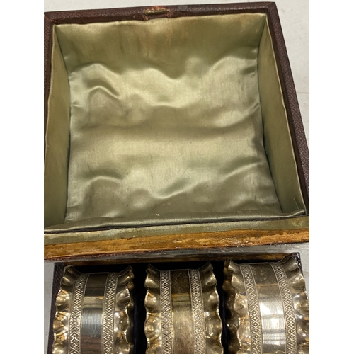 156 - A BOXED SET OF SIX SILVER PLATED NAPKIN RINGS