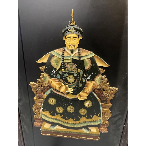 320 - A LARGE PAIR OF ORIENTAL WOODEN FRAMED PLAQUES WITH RESIN FIGURAL DESIGN, 91 X 61CM