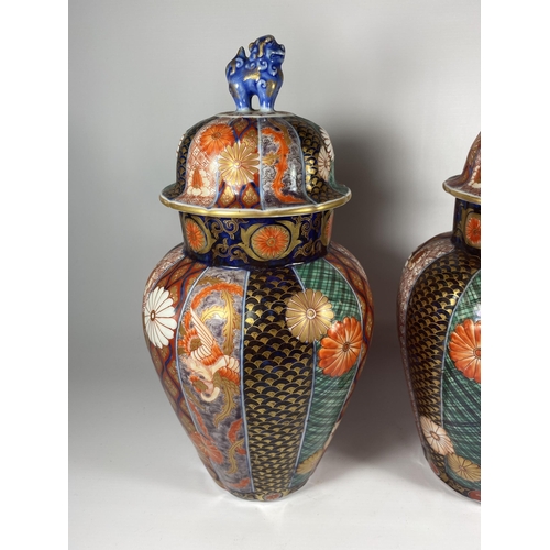 322 - A PAIR OF JAPANESE IMARI MEIJI PERIOD (1868-1912) OVOID FORM LIDDED JARS WITH FOO DOG FINIALS (ONE A... 