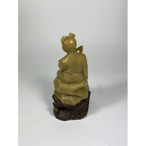 329 - AN ORIENTAL JADE STYLE FIGURE, HEIGHT 16CM