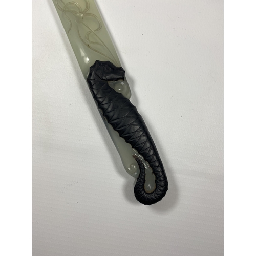 345 - A JADE TYPE ORIENTAL HARDSTONE PAGE TURNER / LETTER OPENER, WITH SEAHORSE DESIGN HANDLE