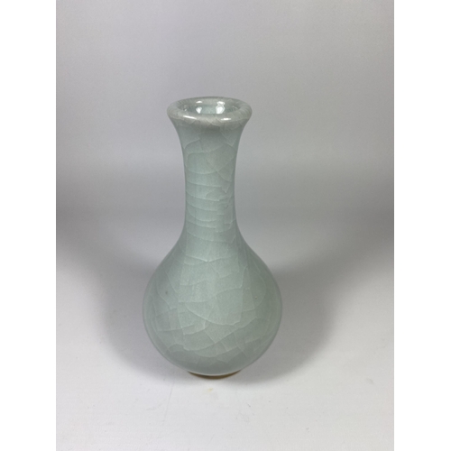 368 - A CHINESE CELADON GROUND PORCELAIN BOTTLE VASE ON CARVED WOODEN STAND, HEIGHT OF VASE 18CM