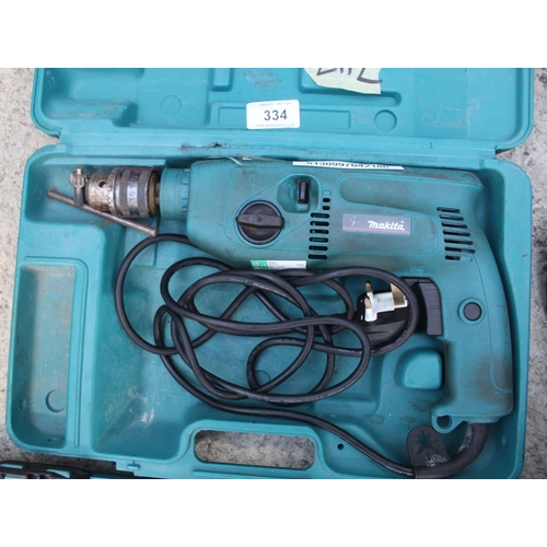 334 - A MAKITA ELECTRIC DRILL WITRH CARRY BOX AND CHUCK PLUS VAT