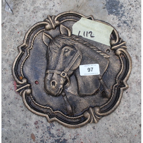 97 - A LARGE CAST IRON HORSE COAT HOOK PLUS VAT