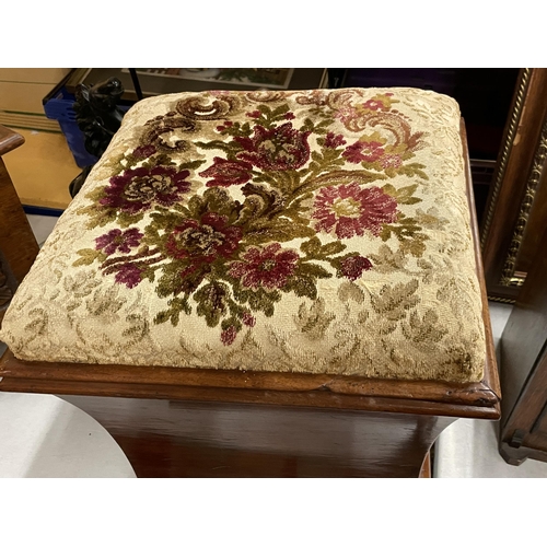 69 - A MAHOGANY OTTOMAN ON BUN FEET WITH BRASS HANDLES AND FLORAL EMBROIDERED SEAT