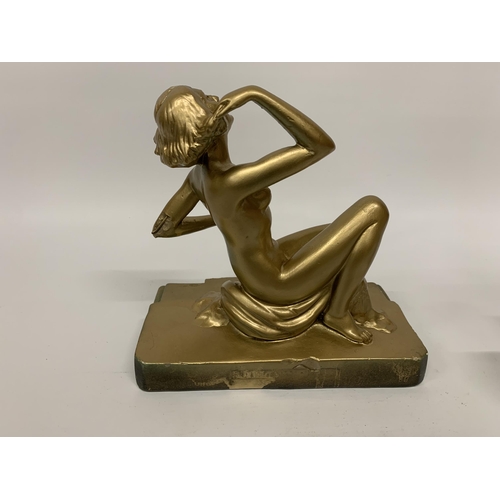 111 - A METAL ART DECO STYLE GOLD COLOURED FIGURE 'RING LADY' HEIGHT 23CM, LENGTH 24CM