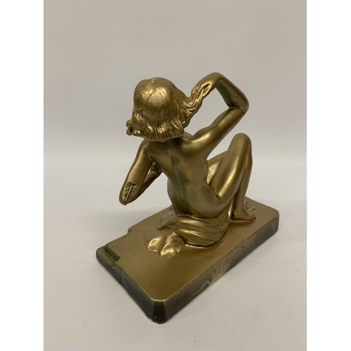 111 - A METAL ART DECO STYLE GOLD COLOURED FIGURE 'RING LADY' HEIGHT 23CM, LENGTH 24CM