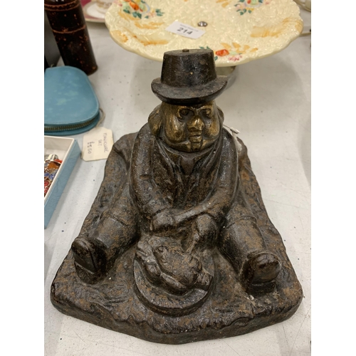 213 - A VINTAGE CAST DOORSTOP OF A MAN WITH A CARVING KNIFE